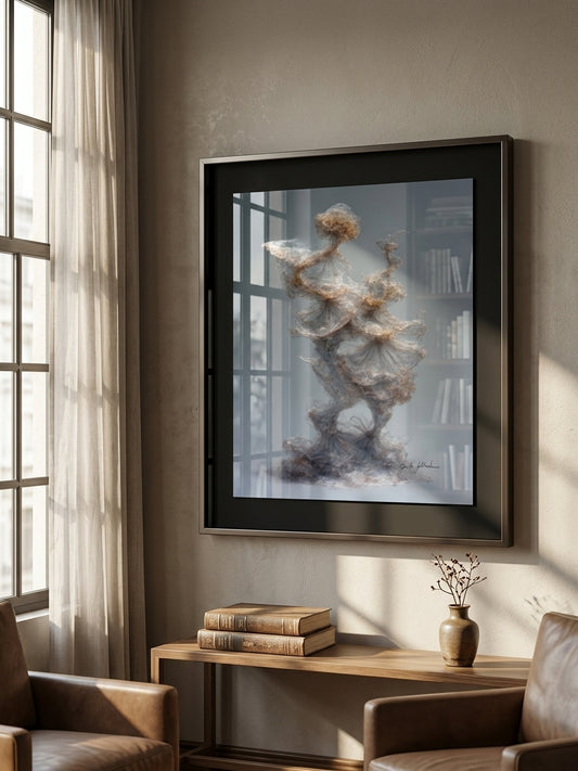 Framed abstract art piece on a wall with books and a vase on a table below.