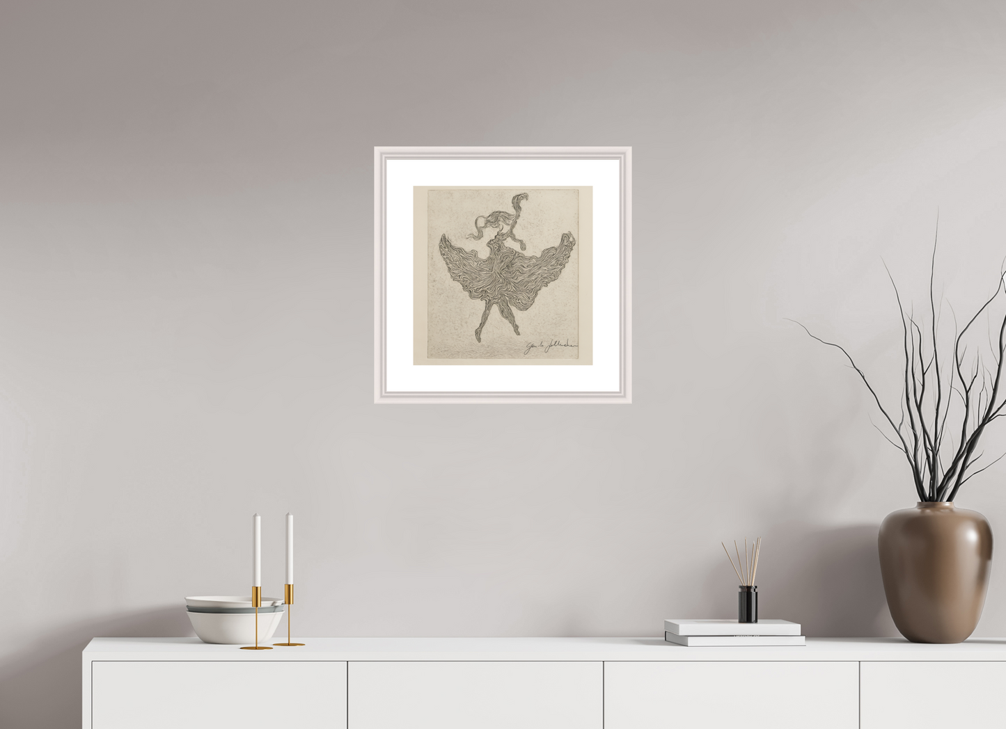 Framed artwork of a dancer on a wall above a white console table with decorative items.
