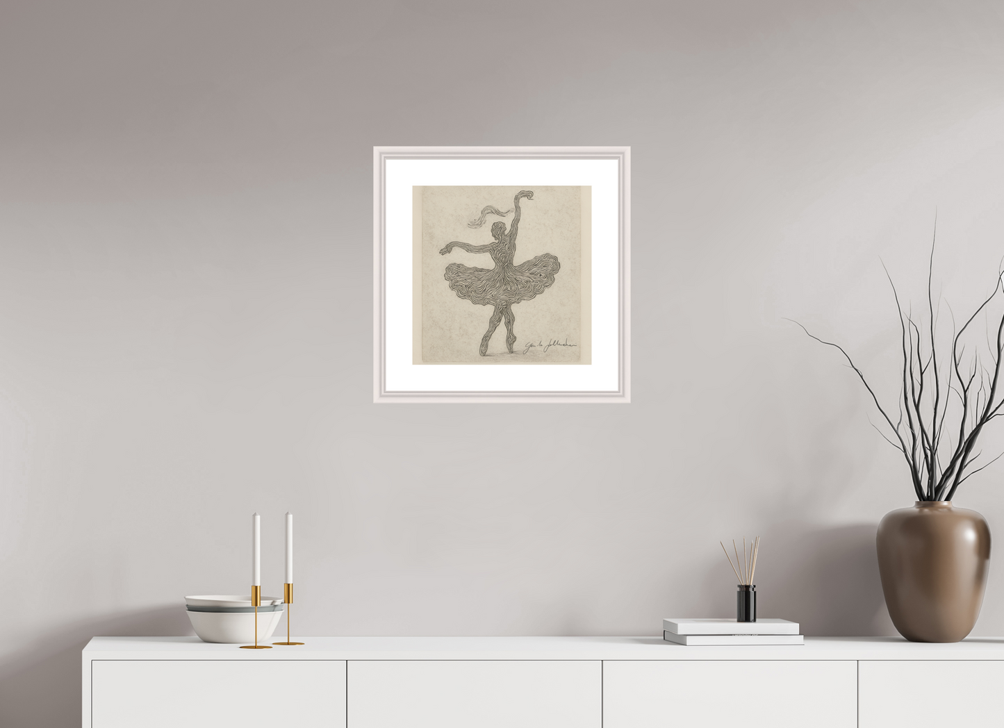 Framed artwork of a dancer on a wall above a white console table with decorative items.