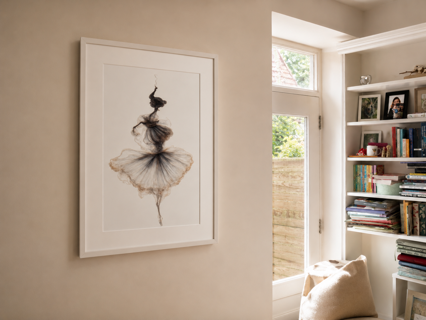 Framed artwork of a ballerina on a wall in a room with bookshelves.