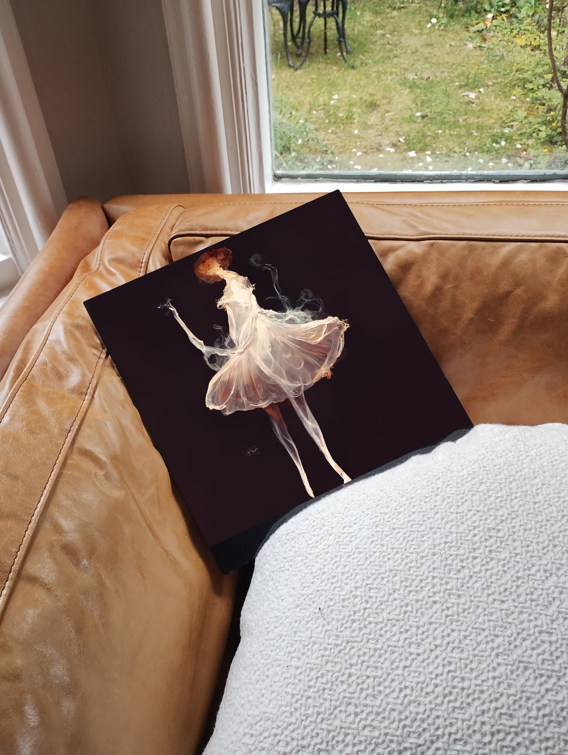 Canvas print of a ballerina on a couch with a window in the background